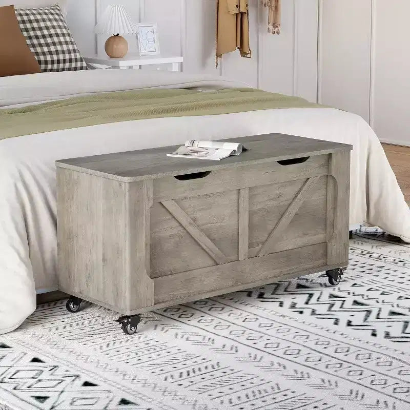 Banc de rangement gris avec roues et charnières de sécurité